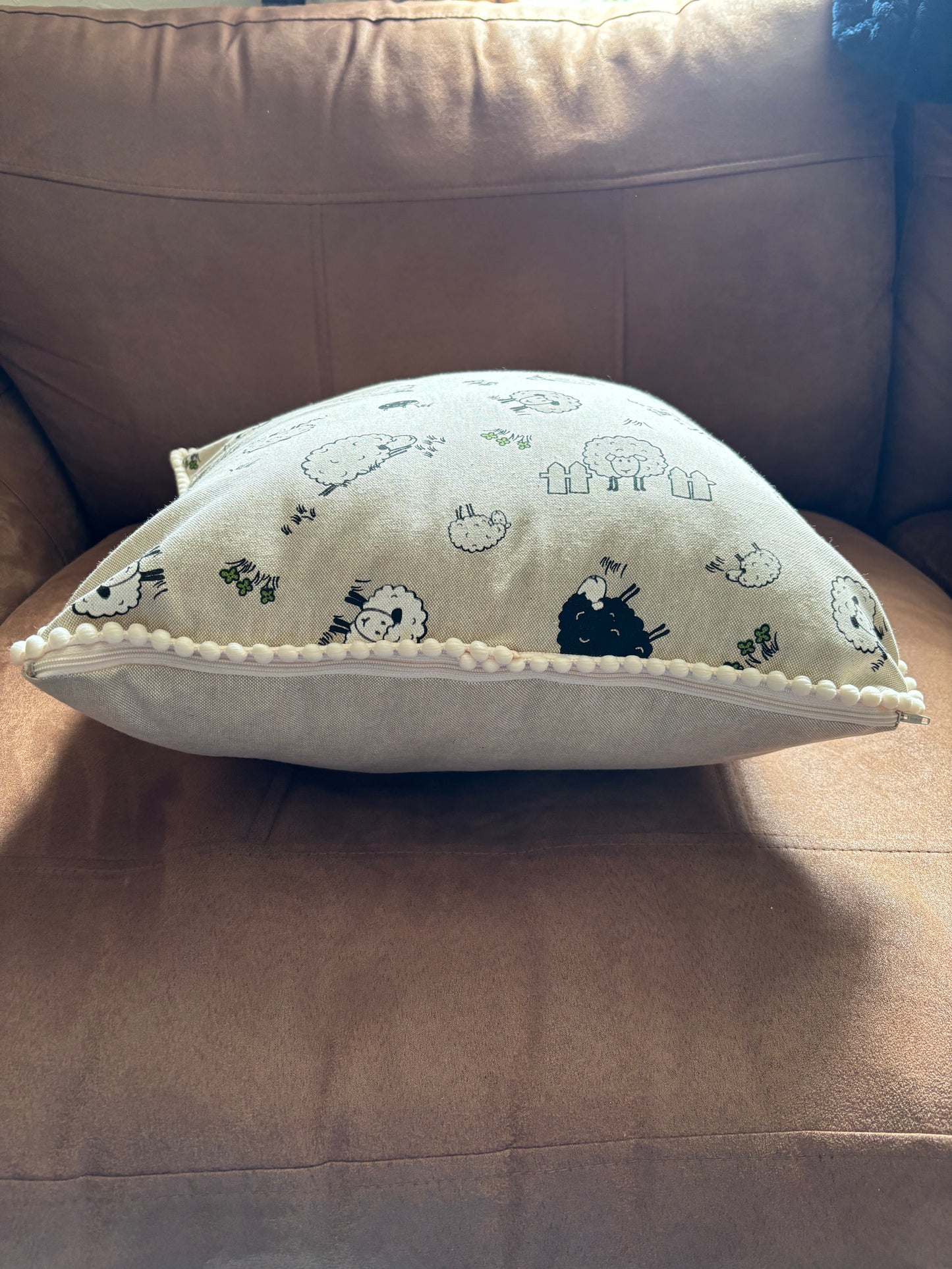 Sheep pom pom cushion