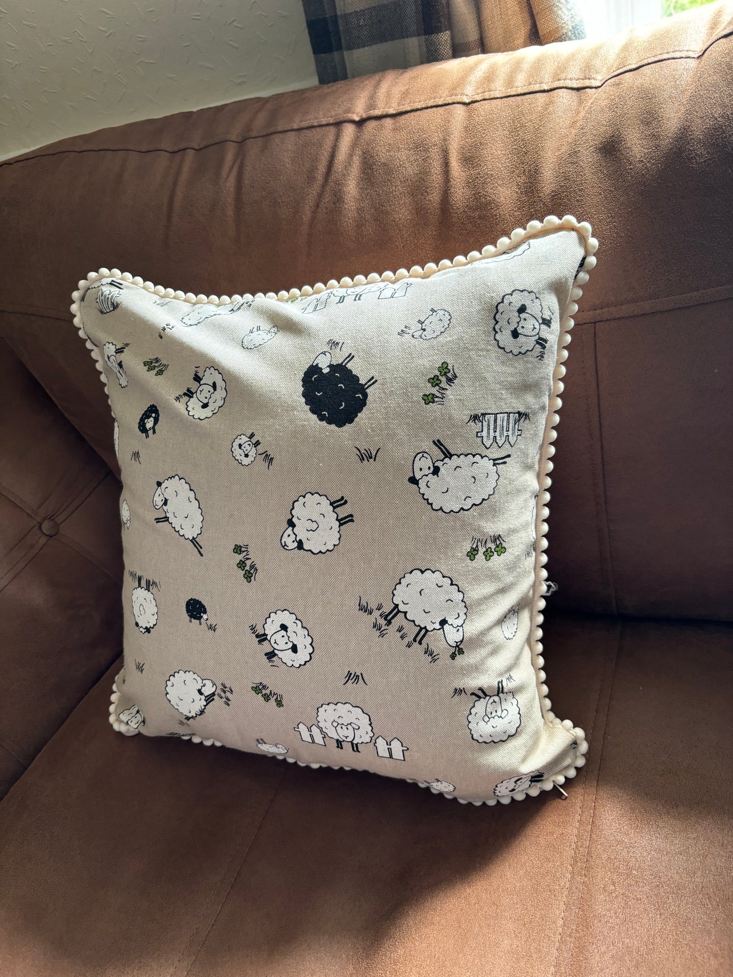 Sheep pom pom cushion